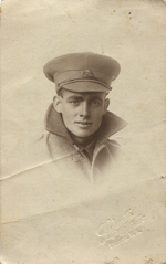 Unknown soldier with collar turned up.