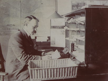 In his office at the Barracks in Perth, c.1900 (info)